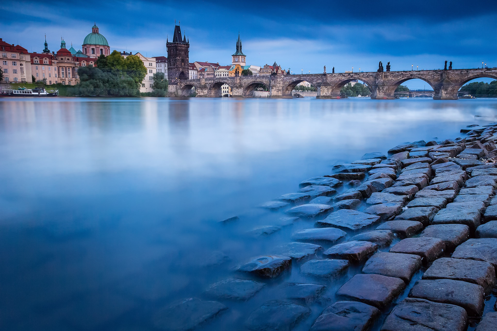 Charles bridge in historical Prague after sunset